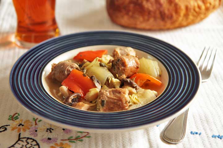 Braised Italian sausage with artichokes and sweet peppers