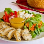 Easy salad with skillet fried chicken breast, fresh vegetables and ginger vinaigrette