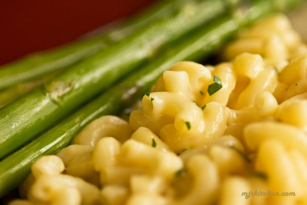 Close up of macaroni and cheese with asparagus
