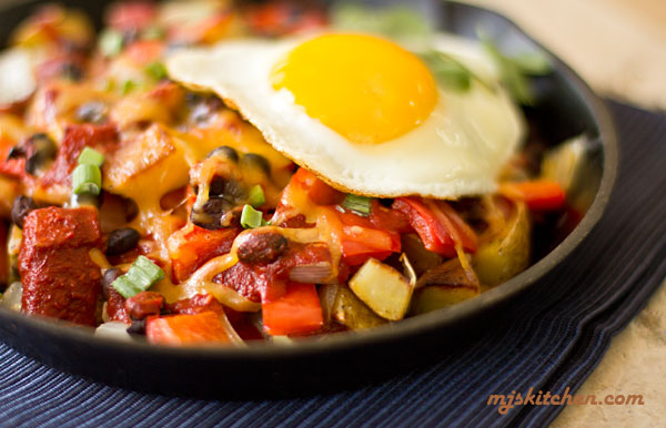 A classic southwestern breakfast pileup with potatoes, vegetables, a protein, and an egg. #red #chile @mjskitchen mjskitchen.com 