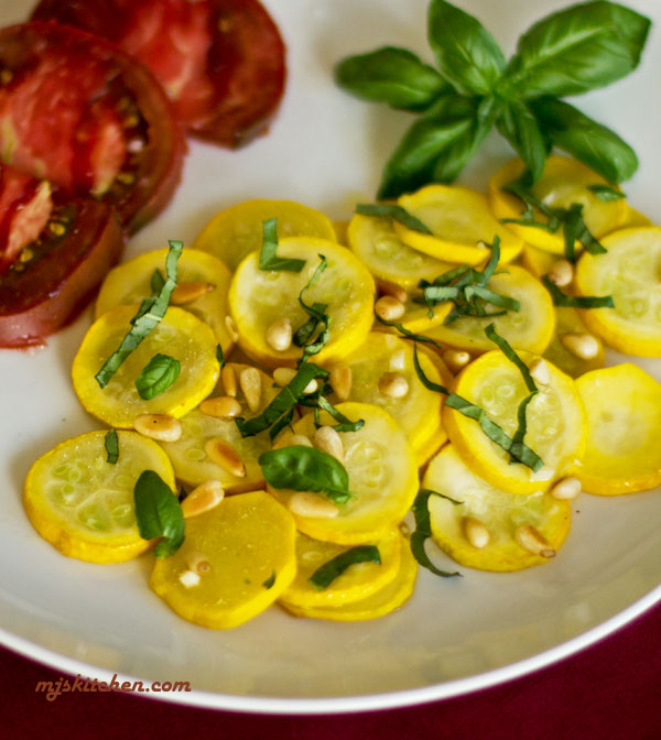 A quick sauteed yellow squash with fresh basil and toasted pinon (pine nuts)