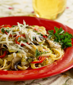 A vegetarian pasta with leek confit, mushrooms, and sweet red peppers