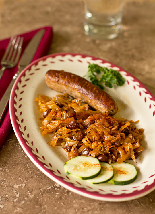 Sausage braised with cabbage, onions and raisins