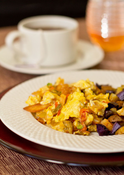 Southwestern style migas is a dish that consists of scrambled eggs, green chile, and fried corn tortillas