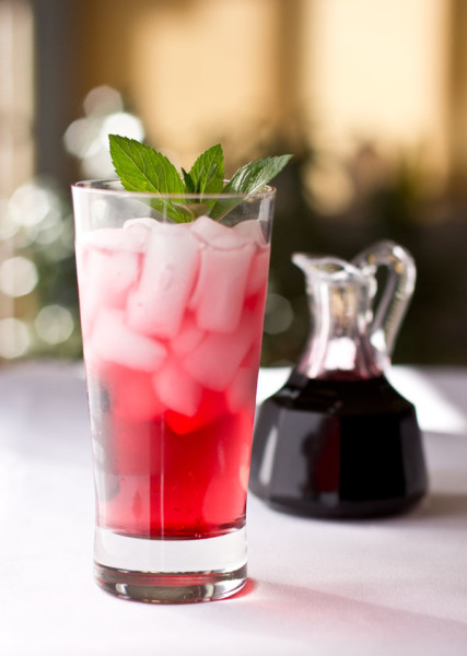 A refreshing beverage made with hibiscus simple syrup and sparkling water mjskitchen.com @MJsKitchen