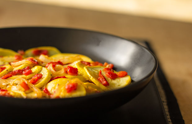 A simple side dish of sauteed summer squash with roasted red peppers |mjskitchen.com