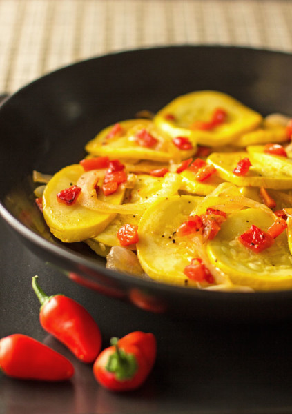 A simple sauteed side dish of yellow squash with red peppers. The peppers are roasted to bring out their sweetness. #summer #squash #recipe @mjskitchen