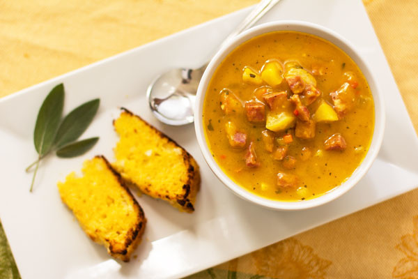 A robust pumpkin soup seasoned with sage and enhanced with apples and sausage for flavor and texture #soup #pumpkin mjskitchen.com