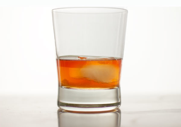 An Old Fashioned Cocktail enhanced with a dash of orange bitters and cranberries #cocktail #old-fashioned | mjskitchen.com