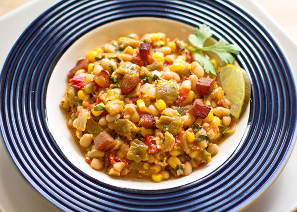 A hearty one pot meal with navy beans and green chile, corn, tomatoes and a host of other goodness. #green #chile #beans mjskitchen.com