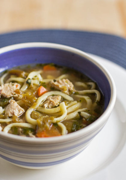 A hearty and healthy green chile chicken noodle soup with roasted garlic and homemade noodles #green #chile #soup #noodles @mjskitchen