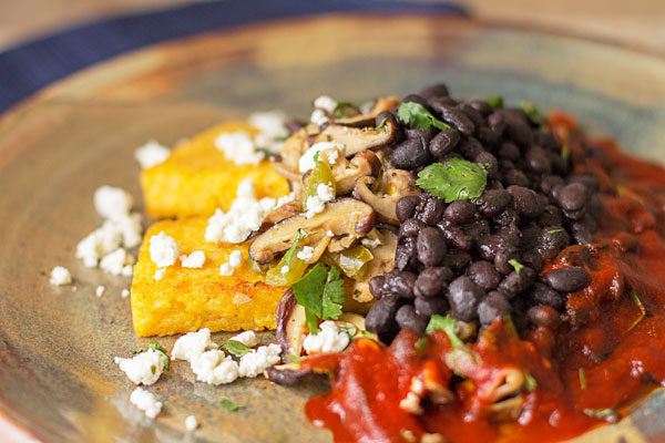 A hearty vegetarian meal with shiitake, black beans, fried polenta and feta smothered in New Mexico red chile | mjskitchen.com