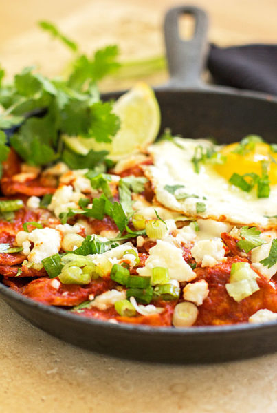 Red Chile Chilaquiles - An easy dish with corn tortillas, New Mexico red chile, an egg and topping of your choice. #redchile #chilaquiles @mjskitchen