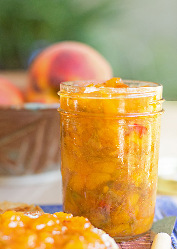 Green chile peach preserves are made with fresh peaches, roasted chile, and no pectin. A delicious jar of sweet and spicy. #greenchile #Hatchchile #jam #preserves @mjskitchen