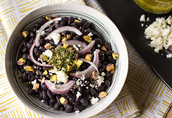 A mouthwatering bowl of black beans, chimichurri, and pickled onion with cotija cheese and pistachios. #blackbeans #chimichurri | mjskitchen.com