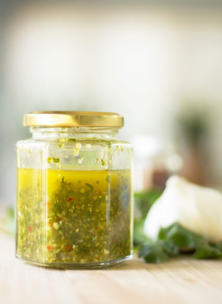 A chimichurri sauce that uses a combination of parsley and cilantro, and lots of garlic (a standard ingredient for chimichurri) #chimichurri #pebres #cilantro #parsley