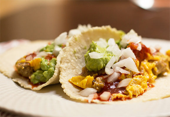 Breakfast tacos with scrambled eggs, chorizo, red chile, and guacamole #tacos #breakfast #redchile | mjskitchen.com