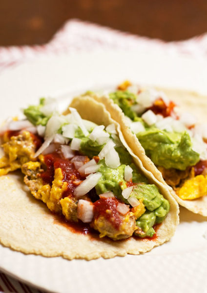 Breakfast taco with scrambled eggs, chorizo, red chile, and guacamole #tacos #breakfast #redchile @mjskitchen