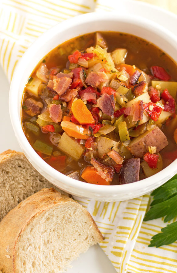 A hearty and healthy garden vegetable soup made with early fall vegetables and topped with a little bacon. #soup #redchile #vegetable @mjskitchen