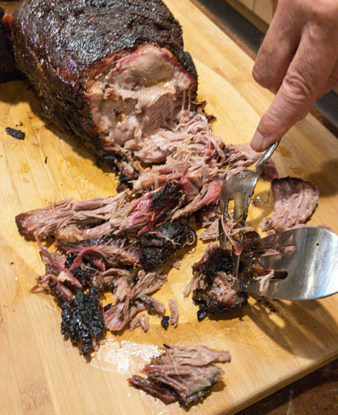 A smoked pork shoulder spicy seasoning and smoked to perfection in a pit barrel smoker #pulledpork #smoked @mjskitchen