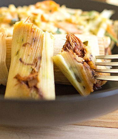 Smoked pulled pork tamales with barbecue sauce and dill pickles. It's like eating a BBQ sandwich. #barbecue #pulledpork #tamales @mjskitchen