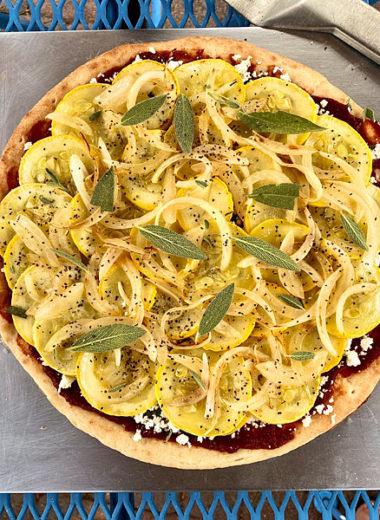 A grilled yellow squash pizza with pizza sauce, feta, and sage #squash #yellow #pizza @mjskitchen