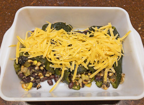 Poblano peppers stuffed with squash, corn, black beans, olives and cheese. @mjskitchen