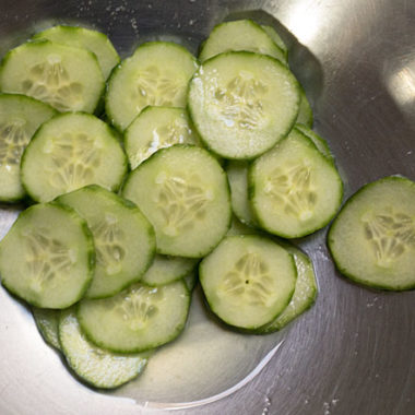 To prep cucumber for Kimchi, brine thin slices in salt to remove moisture.