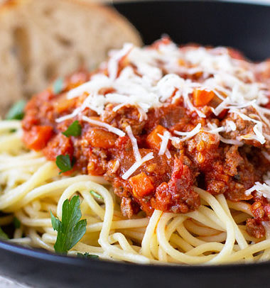 The tastiest bolognese you'll ever serve. Slow-cooked with seasoned sausage and beef, canned or fresh tomatoes. #bolognese #spaghetti #pasta @mjskitchen
