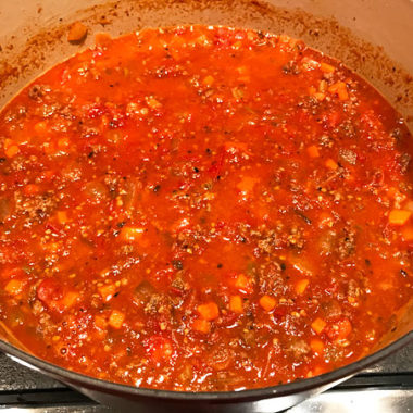 The tastiest bolognese you'll ever serve. Slow-cooked with seasoned sausage and beef, canned or fresh tomatoes. #bolognese #spaghetti #pasta @mjskitchen