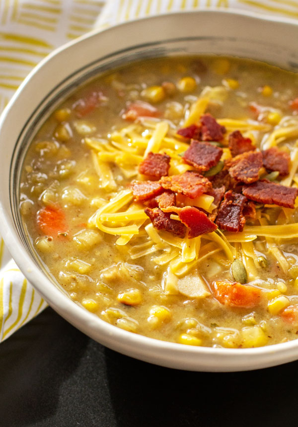 A hearty Green Chile Leek and Potato soup loaded up with carrots, corn and mushrooms. #soup #greenchile #leeks #glutenfree @mjskitchen