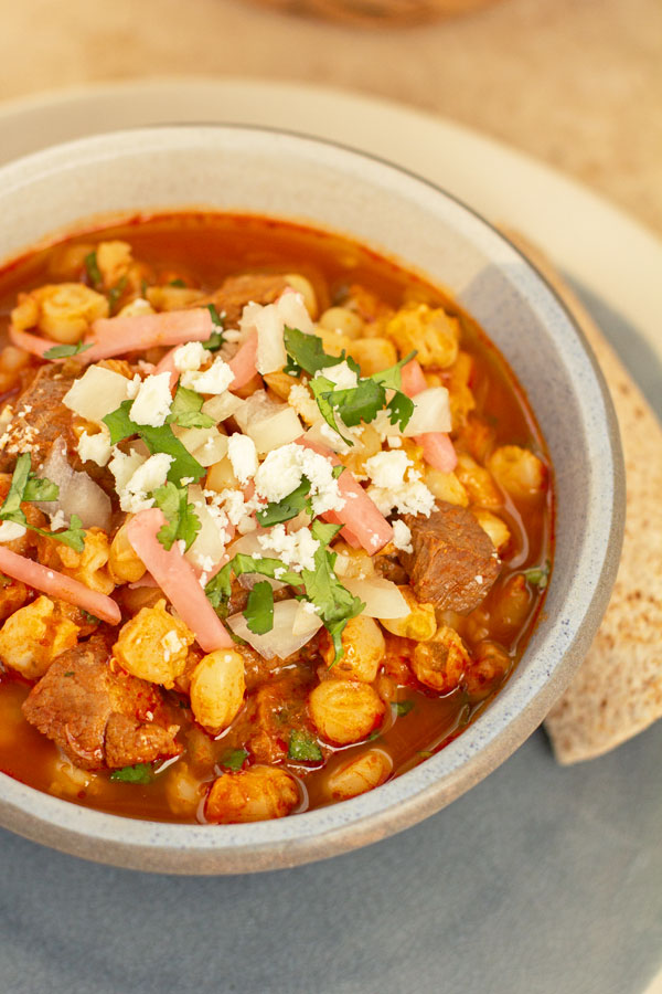A traditional New Mexican red chile posole with pork and red chile. #redchile #posole #pozole #NewMexico @mjskitchen