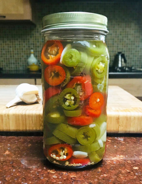 An easy sweet and spicy pickled jalapeño that can used in a variety of dishes, as a topping for just about anything, or eaten right from the jar. #pickled #jalapeño #peppers @mjskitchen